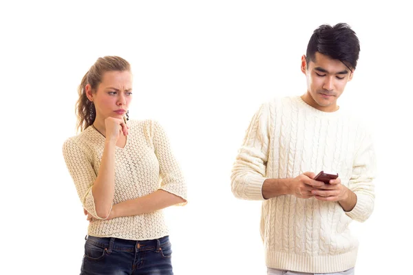 Man using smartphone and woman arguing — Stock Photo, Image