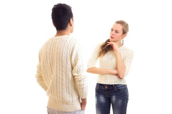 Young couple in white sweaters talking — Stock Photo, Image