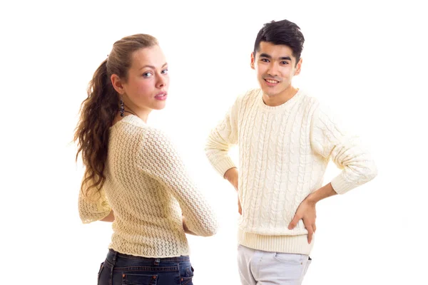 Young couple in white sweaters — Stock Photo, Image