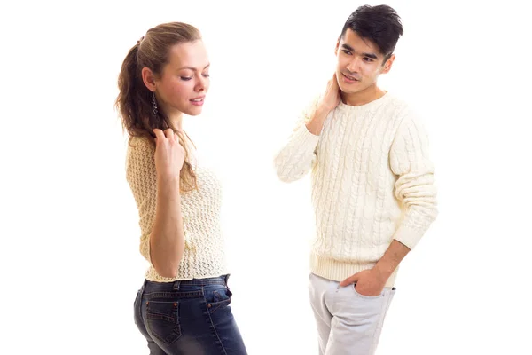 Young couple in white sweaters — Stock Photo, Image