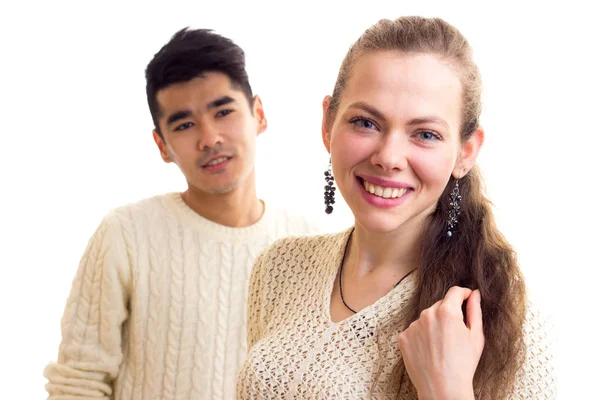 Young couple in white sweaters — Stock Photo, Image