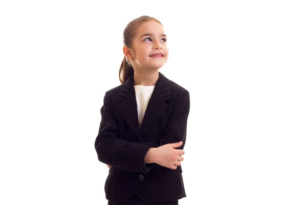 Klein meisje in zwarte jas — Stockfoto