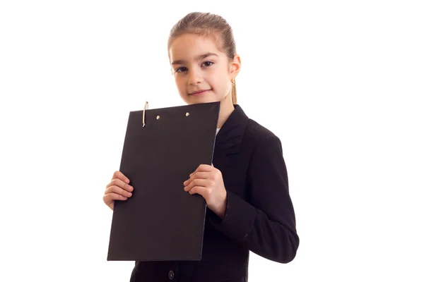 Klein meisje in zwarte jas — Stockfoto