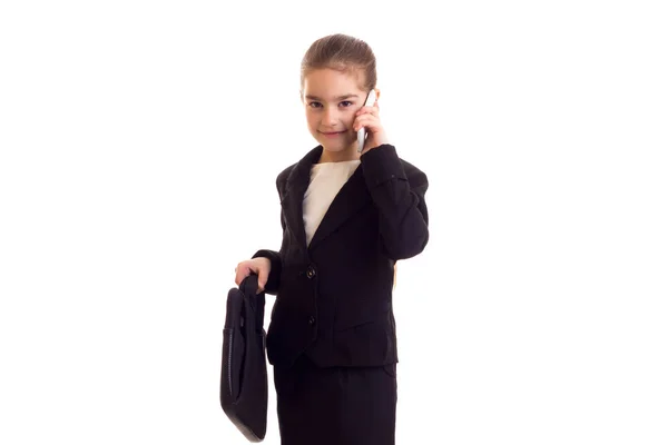 Niña en chaqueta negra sosteniendo diplomático — Foto de Stock