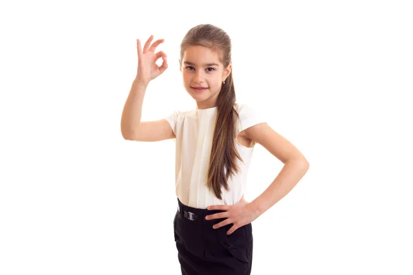 Klein meisje in wit T-shirt en zwarte rok — Stockfoto