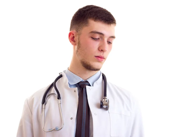 Ung man i läkare klänning — Stockfoto