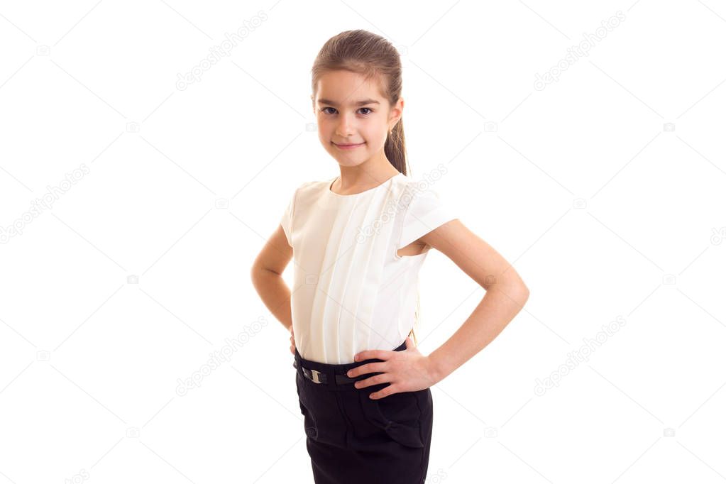 Little girl in white T-shirt and black skirt