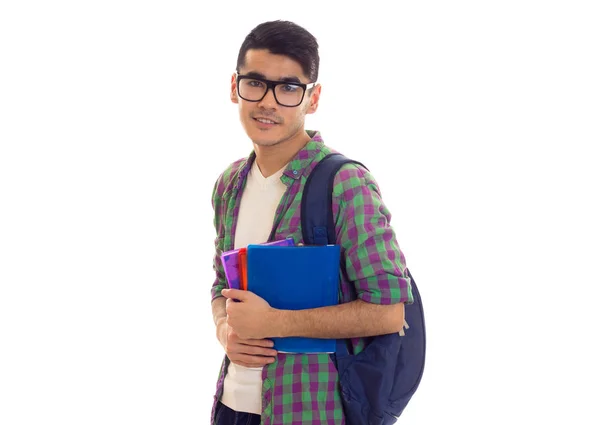 Jonge man met rugzak en boeken — Stockfoto