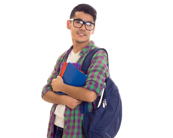 Mladý muž s batohem a knihy — Stock fotografie