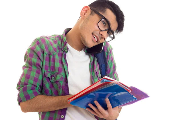 Mladý muž s batohem, smartphone a knihy — Stock fotografie