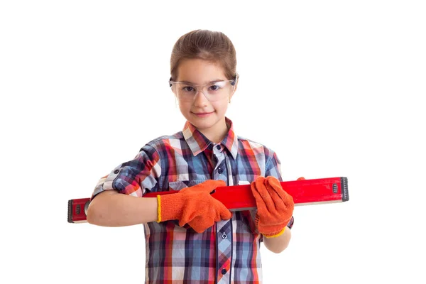 Menina segurando edifício nível — Fotografia de Stock