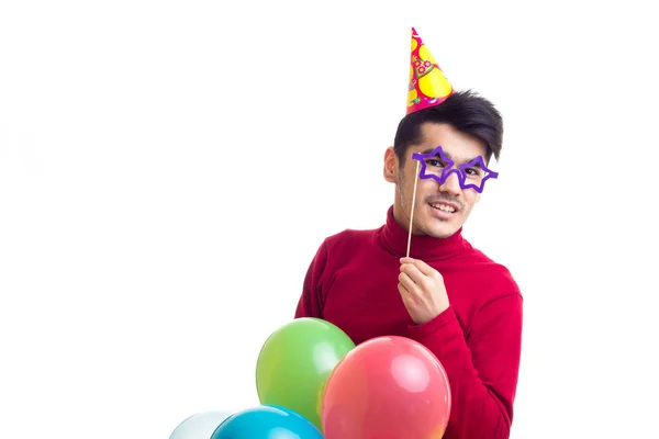 Jovem segurando balões — Fotografia de Stock