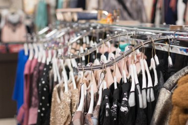 Women fashion, new colorful vintage dress hanging on the rail for Sale in The Market for Summer Season to Wear at The Beach