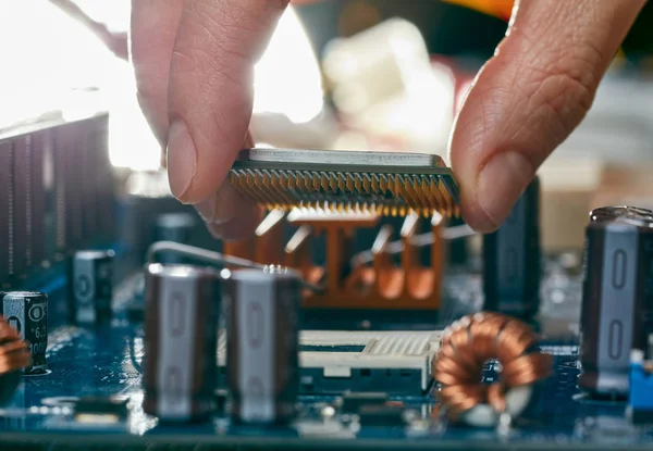 Plug in CPU microprocessor to motherboard socket — Stock Photo, Image