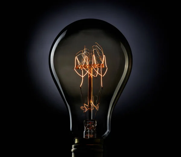 Light bulb on black background