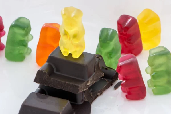 Slice of chocolate and gummy bears — Stock Photo, Image