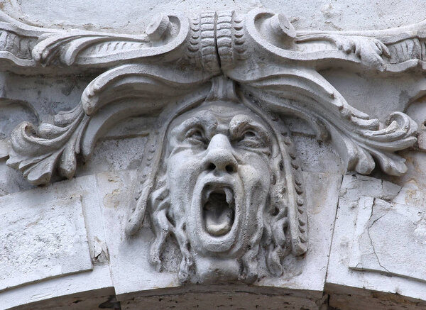 carved stone face