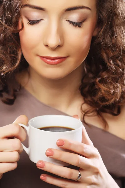 Young curly woman drinking coffee — Stock Photo, Image