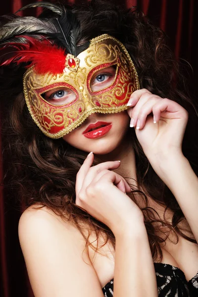 Vrouw met Venetiaanse maskerade carnaval masker Stockfoto