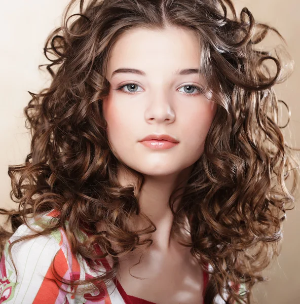 Image of beautiful young woman with curly hair — Stock Photo, Image