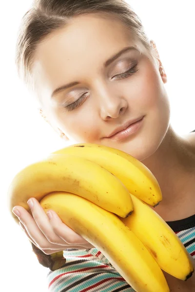 Lachende jonge vrouw met banaan — Stockfoto