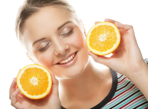 Woman with oranges in her hands studio portrait — Stock Photo, Image