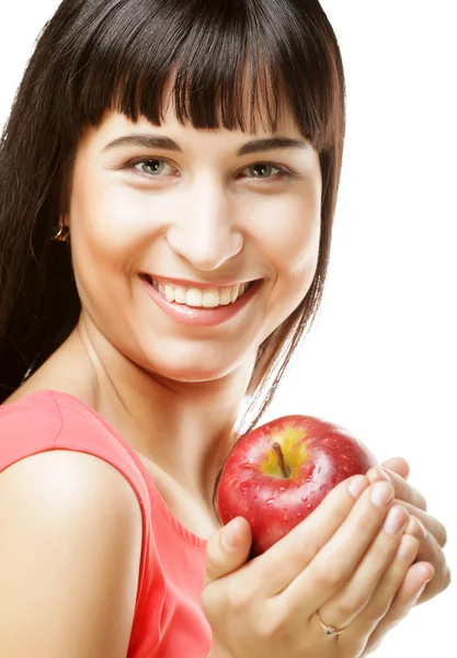 Schöne brünette Frau mit rotem Apfel in den Händen — Stockfoto