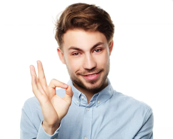 Happy smiling man showing thumb up hand sign on white background — Stock Photo, Image