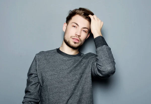 Portrait of sexy man over grey background — Stock Photo, Image