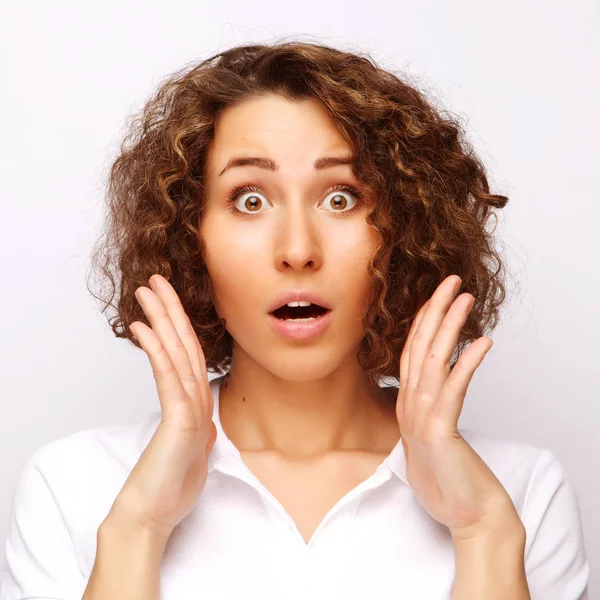 Beautiful young surprised woman. Stock Picture
