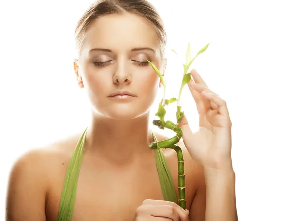 Young beautiful woman with bamboo — Stock Photo, Image