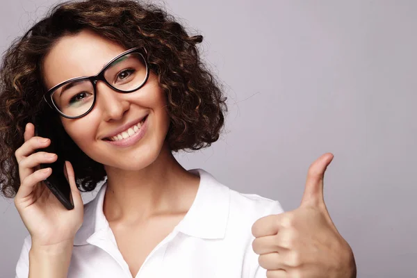 Portrait of smiling business woman phone talking and show OK — Stock Photo, Image