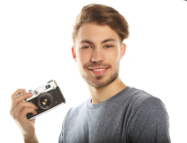 Un joven con cámara. Aislado sobre fondo blanco . — Foto de Stock