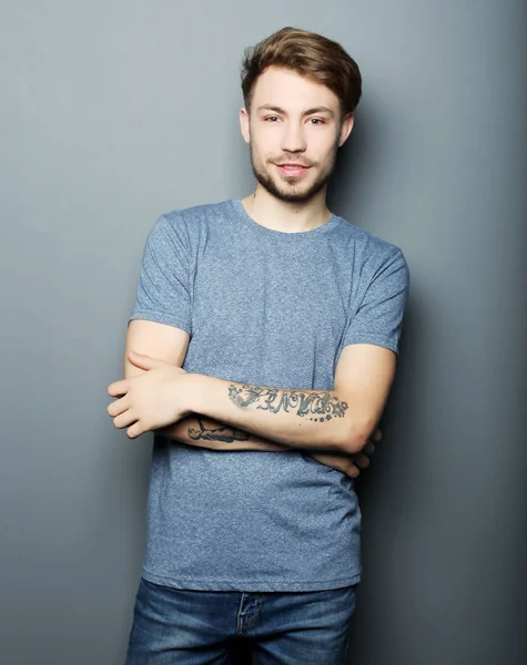 Handsome man in blank grey  shirt — Stock Photo, Image