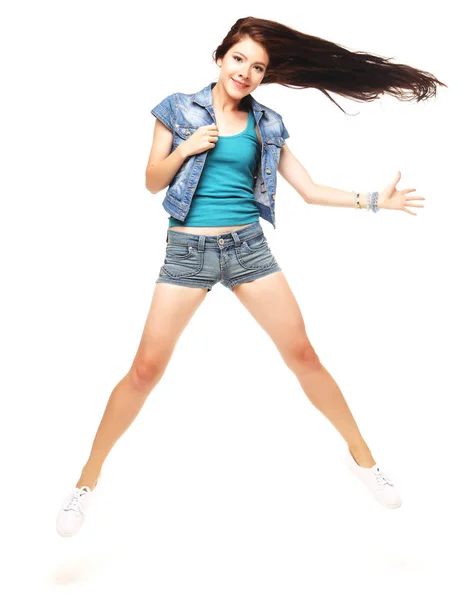 Full length portrait of a cheerful woman jumping  on a white bac — Stock Photo, Image