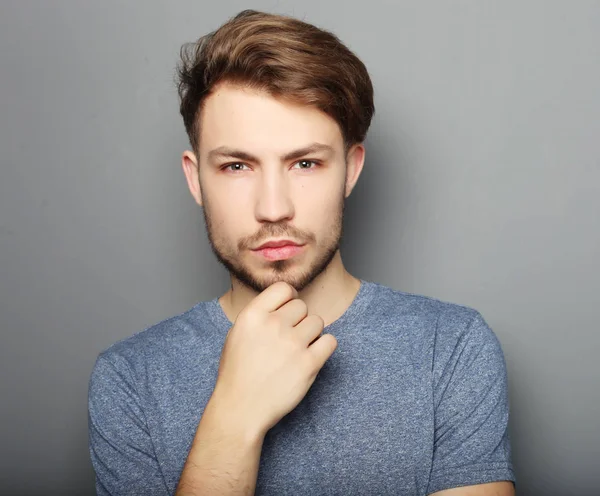 Portrait of sexy man over grey background — Stok Foto