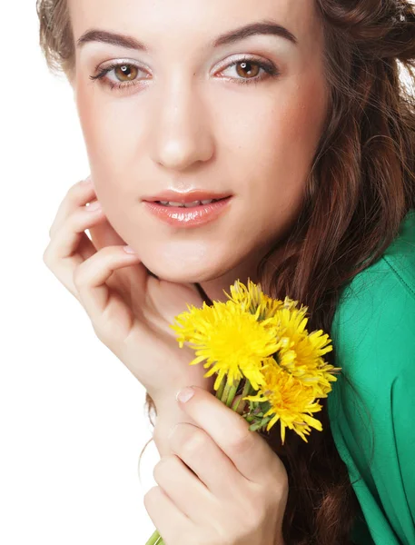 Beautiful young woman with big yellow dandelions — Stock Photo, Image