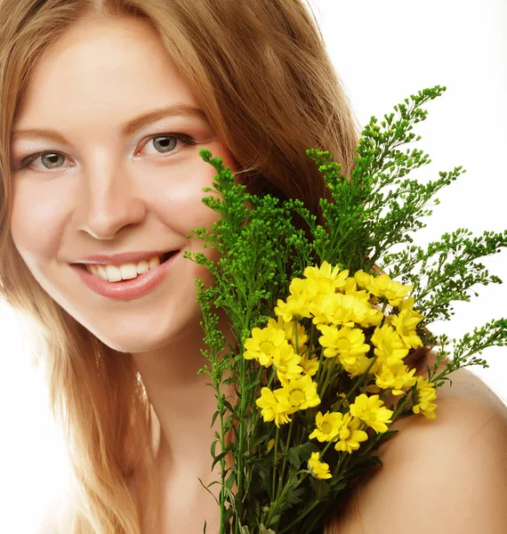 Young beautiful woman with yellow flowers — Stock Photo, Image