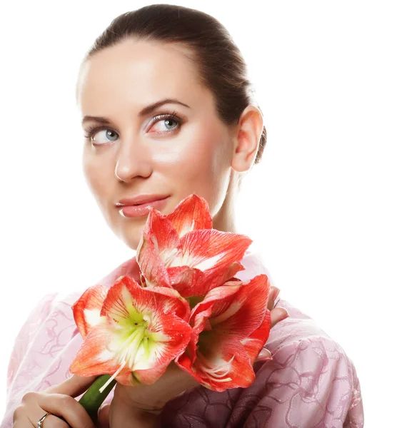 Young beautiful woman with big pink flowers — Stock Photo, Image