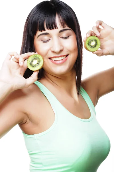 Happy woman holding kiwi — Stock Photo, Image