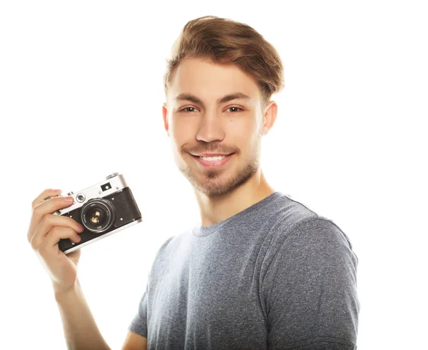 Junger Mann mit Kamera. isoliert über weißem Hintergrund. — Stockfoto