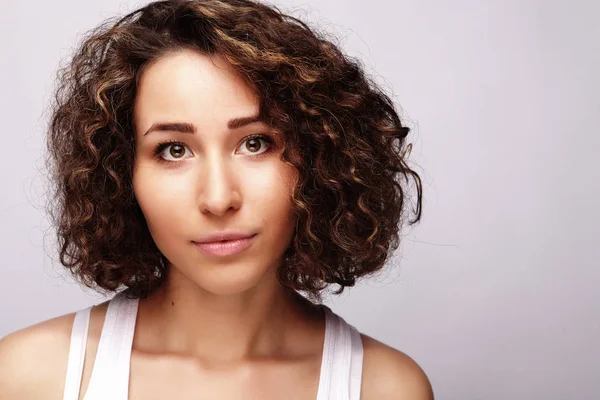 Lifestyle and people concept:Young happy woman with curly hair — Stock Photo, Image