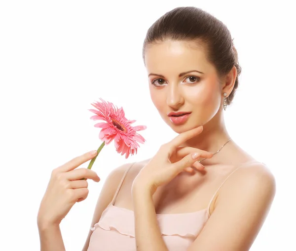 Femme avec fleur de gerber rose isolé sur blanc — Photo