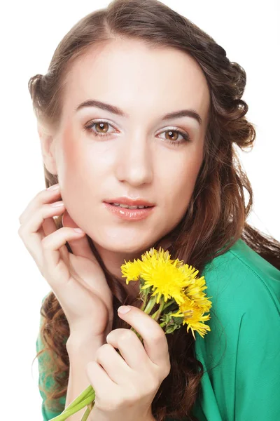 Beautiful young woman with big yellow dandelions — Stock Photo, Image