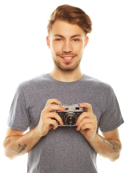 Un joven con cámara. Aislado sobre fondo blanco . — Foto de Stock