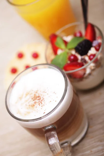 Tasty breakfast - granola, coffee, biscuits and orange juice — Stock Photo, Image
