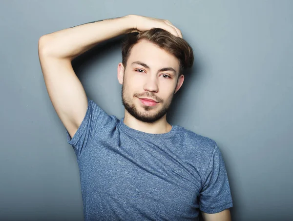 Portrait of sexy man over grey background — Stok Foto