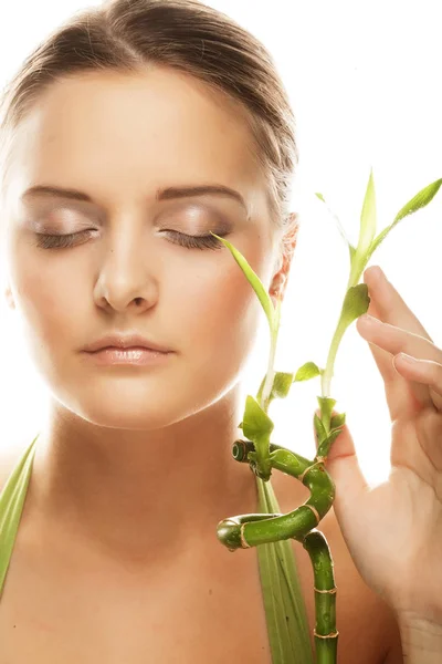 Young beautiful woman with bamboo — Stock Photo, Image