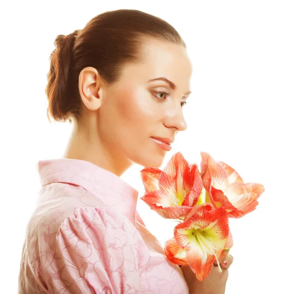 Young beautiful woman with big pink flowers Stock Photo