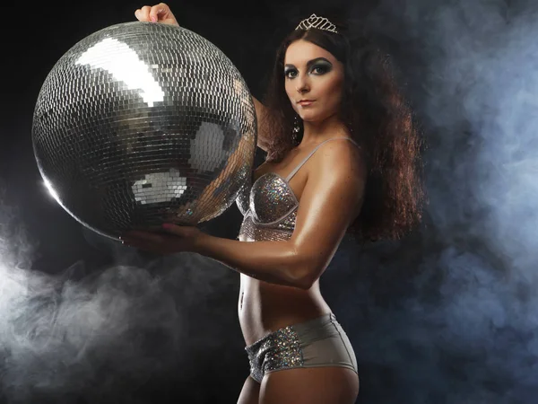 Dancer brunette girl wearing lingerie with disco ball — Stock Photo, Image